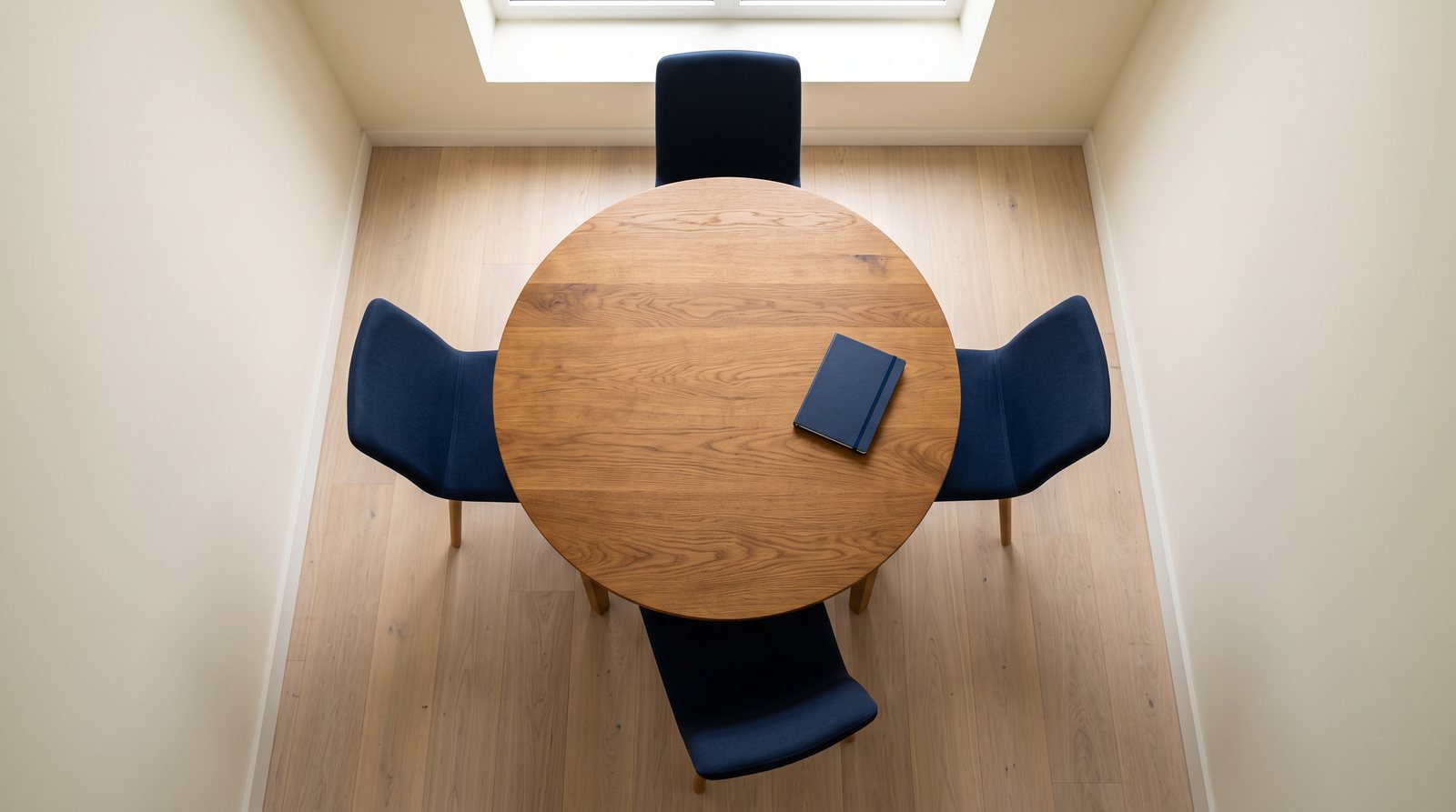 Four office chairs arranged around a table representing advisory team seats